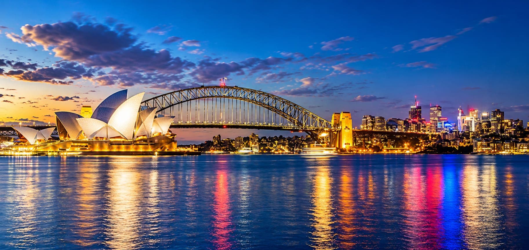 Sydney Opera House and Harbour Bridge lit up at night