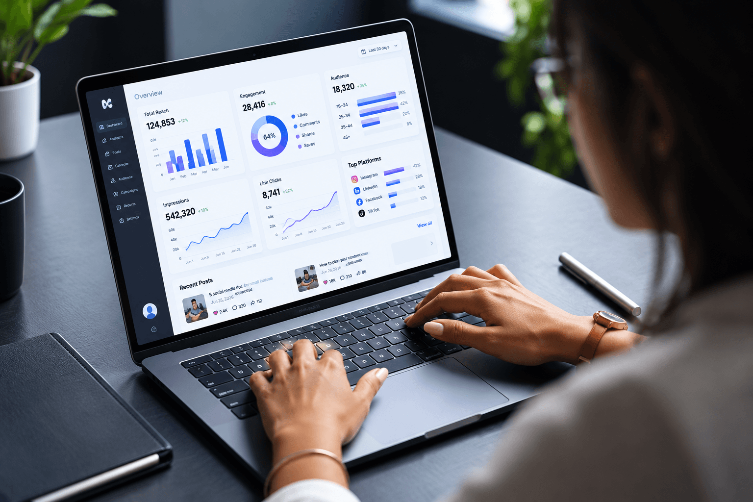 A person reviewing a software dashboard on a laptop